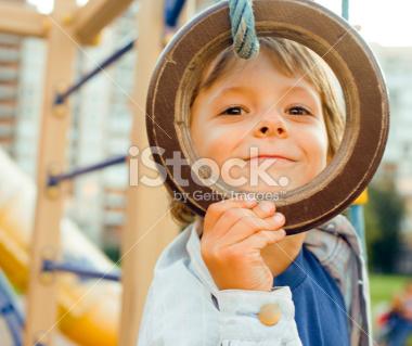 stock-photo-26753240-little-cute-boy-on-playground-outside - Grace